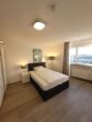 Ab sofort - Schick & modern - möbliertes Zimmer in 3er WG - top Lage mit Skylineblick - Ausschnitt Bett Zimmer 1