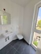 Nagelneu + richtig schick : 3-Zimmerwohnung mit Balkon - ruhig in Offenbach-Ost - Blick ins Gäste WC